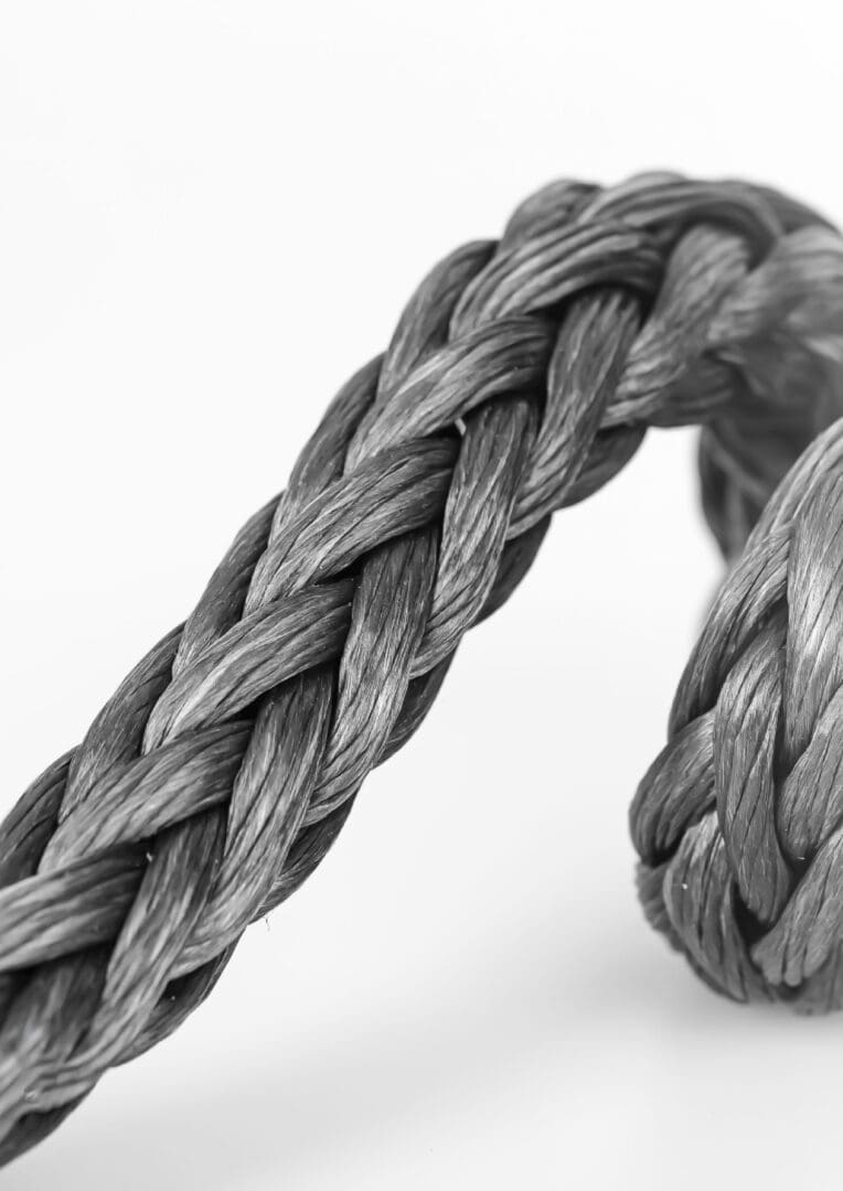 A close up of a rope on a white background